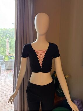 Women's Black Lace-Up Crop Top with Pink neon pink bungee chords. Emma and Sam.